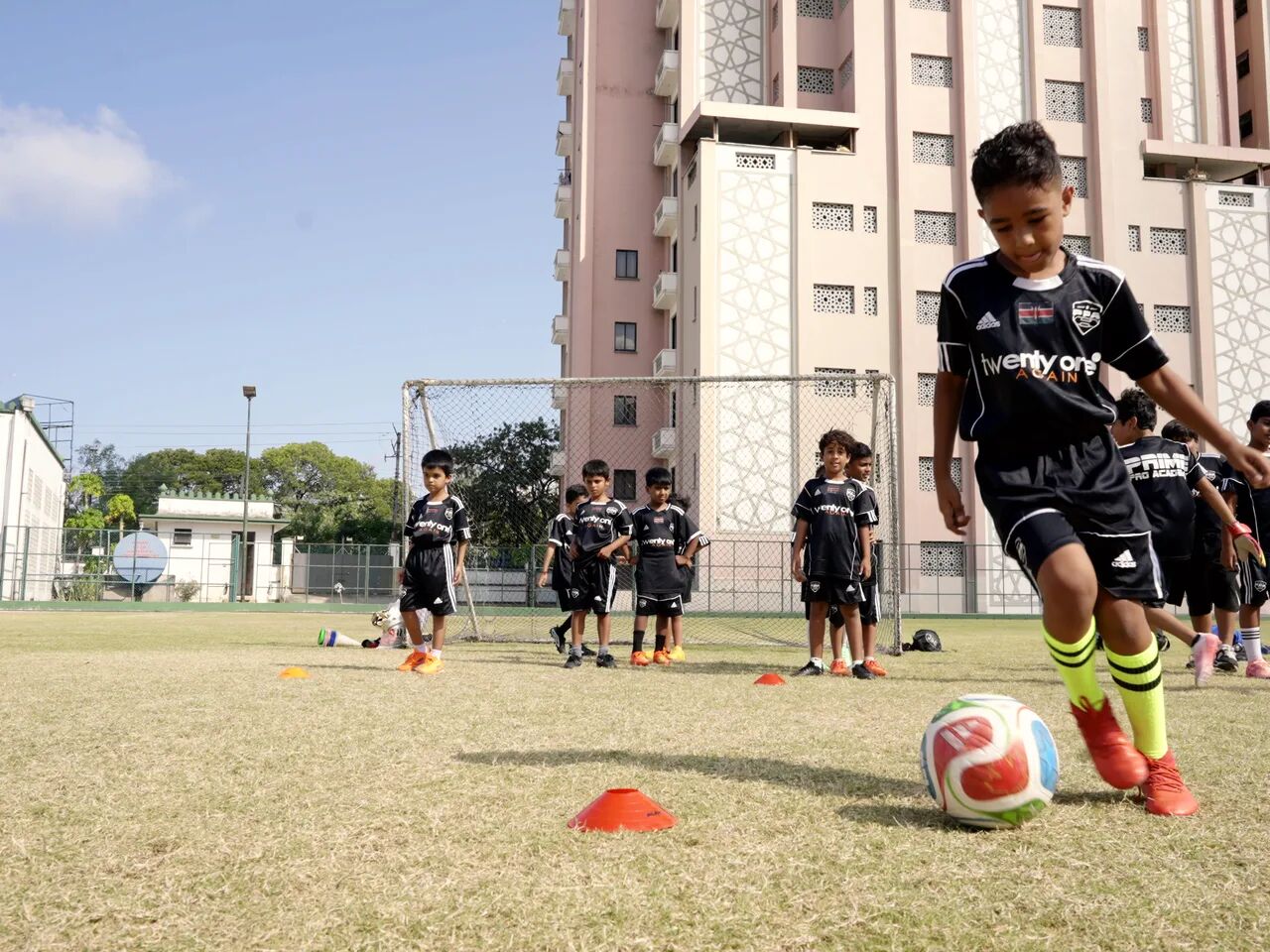 A young Prime Pro Academy player driving forward with the ball