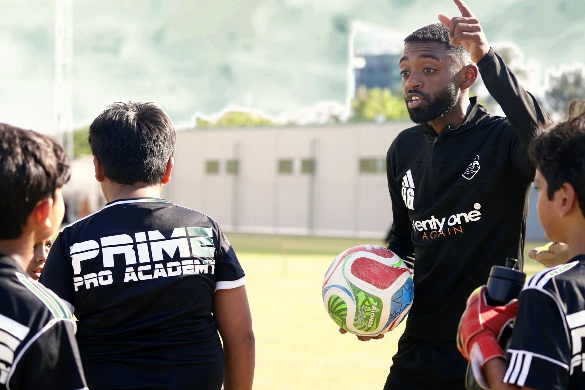 Prime Pro Academy players walking out to train with their coach